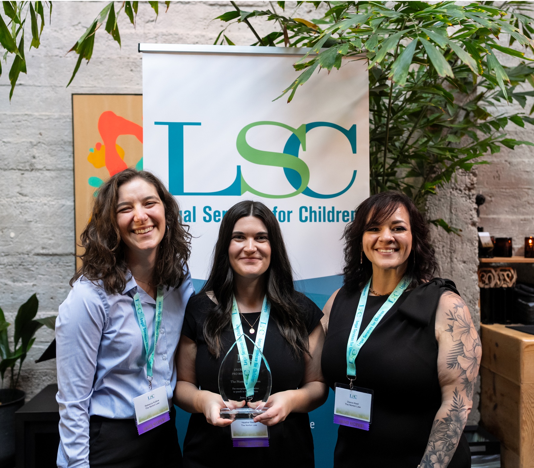 Three volunteer attorneys from LSC's Pro Bono Panel posing with their award at LSC's 2026 annual event